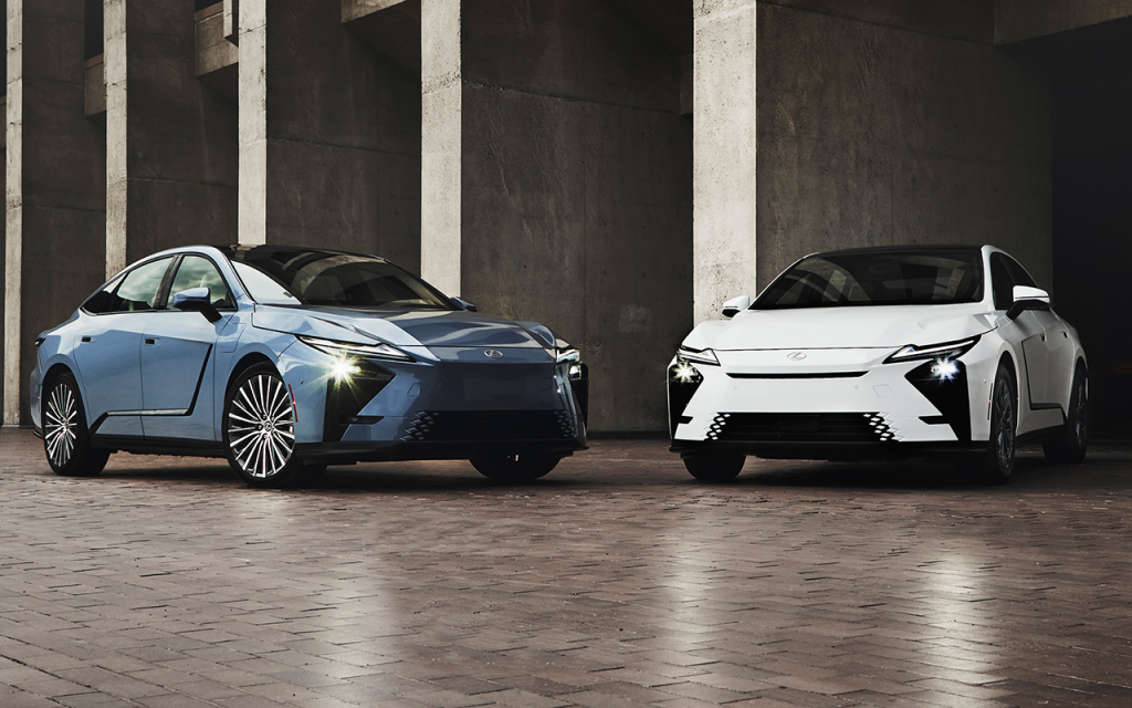 Two 2027 Lexus ES sedans, one blue and one white, parked in a garage