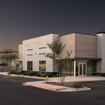 Exterior of a modern industrial building at dusk