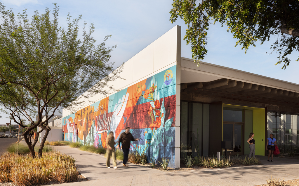 Exterior of the Valley of the Sun United Way office with a colorful mural and desert landscaping